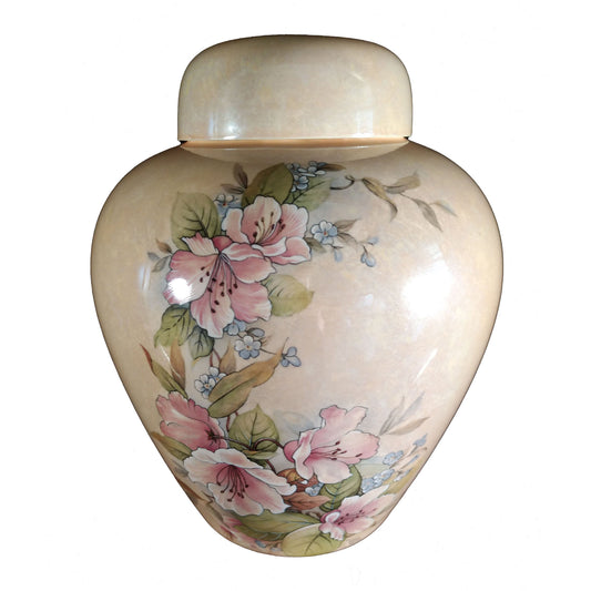 A beautiful medium sized pink cremation ceramic urn with a decoration of pink flowers with a mother-of-pearl finish.