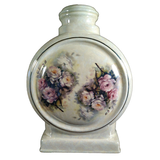 A beautiful large sized cremation ceramic urn with a decoration of pink roses with a gold highlight and mother-of-pearl finish.
