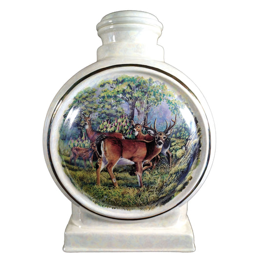 A beautiful large sized cremation ceramic urn with a decoration of a summer scene of four deer with a gold highlight and mother-of-pearl finish.