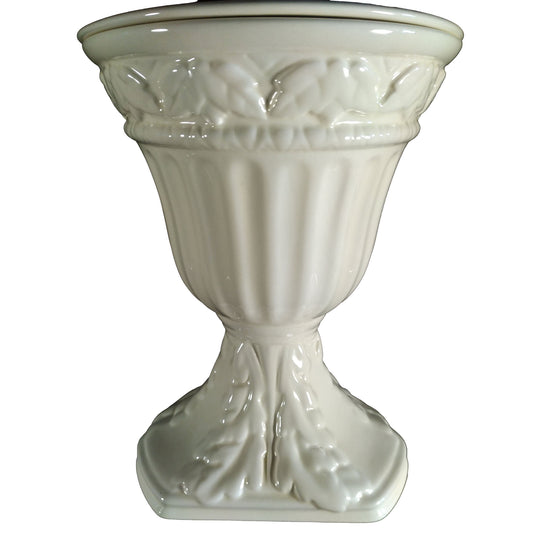 An embossed ceramic cremation urn in a shape of the greek urn finished with mother-of-pearl.