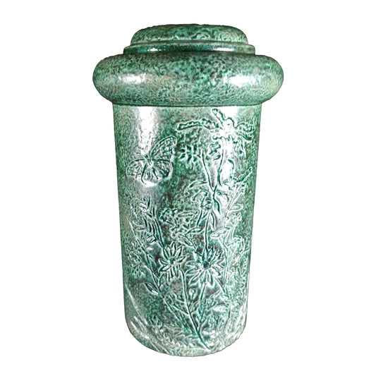 A beautiful urn with butterfly and floral pattern etched into the body of a cremation ceramic urn. This urn is a wonderful shade of green.