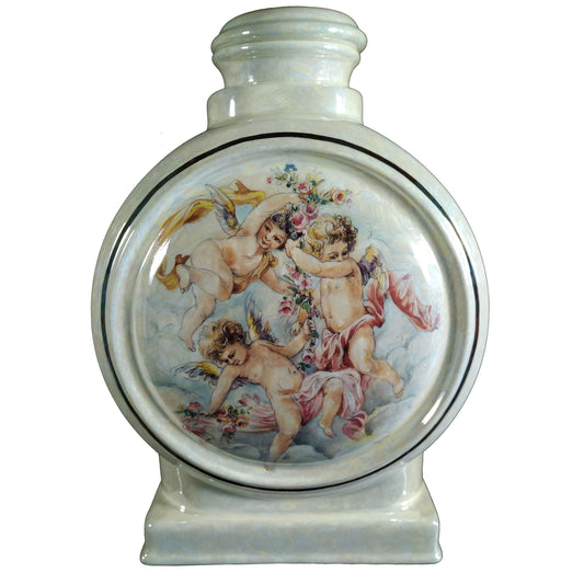 A beautiful large sized cremation ceramic urn with the decoration of three cherubs. There is a gold highlighted outside ring. Front View