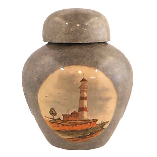 Keepsake urn with a picture of a lighthouse on the seashore, finished with granite-like finish.