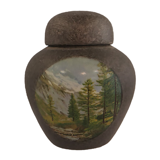 Keepsake urn with a mountain scene picture, finished with granite-like lustre.