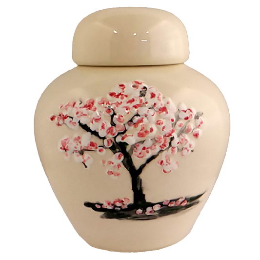 Keepsake urn with a china-painted cherry tree with blossoms.