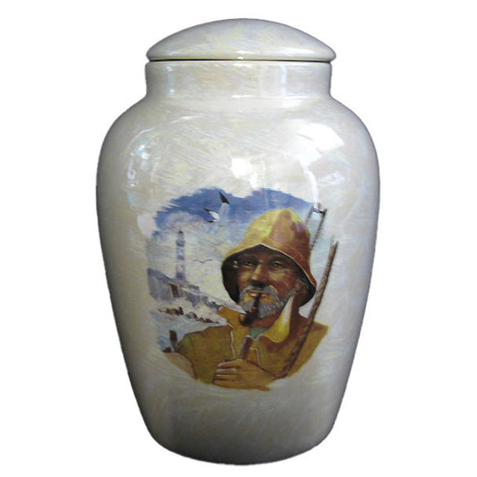 A beautiful medium sized ceramic cremation urn with decoration of a raingear clad fisherman.