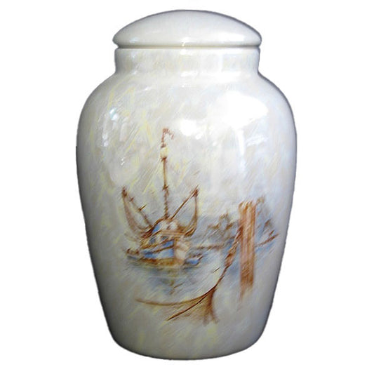 A beautiful medium sized ceramic cremation urn with decoration of a fishing boat.